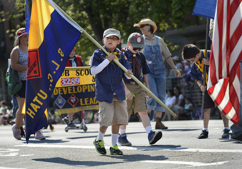 Scott Sommerdorf   |  The Salt Lake Tribune
Boys with the Cub Scouts packs 3289 and 3367 parade during the annual Days of '47 Youth Parade as it flowed through downtown Salt Lake City going west on 500 South and ending at Washington Square, where the Days of '47 Family Festival was held, Saturday, July 19, 2014.