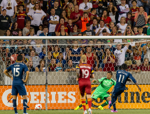 Trent Nelson  |  The Salt Lake Tribune
Vancouver's Darren Mattocks (11) gets a penalty kick past Real Salt Lake's Nick Rimando (18) after a penalty by Real Salt Lake's Nat Borchers (6), as Real Salt Lake hosts Vancouver Whitecaps FC at Rio Tinto Stadium in Sandy, Saturday July 19, 2014.