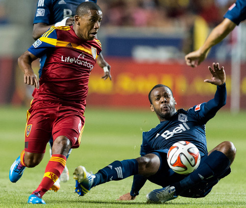 Trent Nelson  |  The Salt Lake Tribune
Real Salt Lake's Joao Plata (8) loses the ball to Vancouver's Carlyle Mitchell (24), as Real Salt Lake hosts Vancouver Whitecaps FC at Rio Tinto Stadium in Sandy, Saturday July 19, 2014.