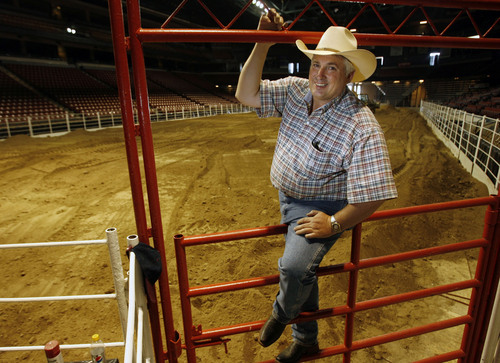 West Valley City -  Days of '47 rodeo chairman Brad Harmon
sits on a gate inside the E Center as dirt gets laid down for this year's rodeo Friday Jul 17, 2009.  The rodeo has moved from the EnergySolutions Arena to the E Center.  Steve Griffin/The Salt Lake Tribune 7/17/09