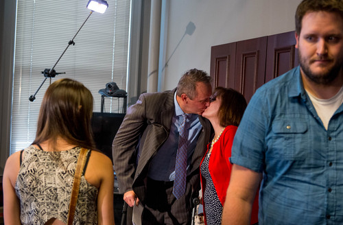 Trent Nelson  |  The Salt Lake Tribune
Former Utah Attorney General Mark Shurtleff kisses his wife, M'Liss Shurtleff, after addressing his arrest on ten felony counts today, in Salt Lake City, Tuesday July 15, 2014.