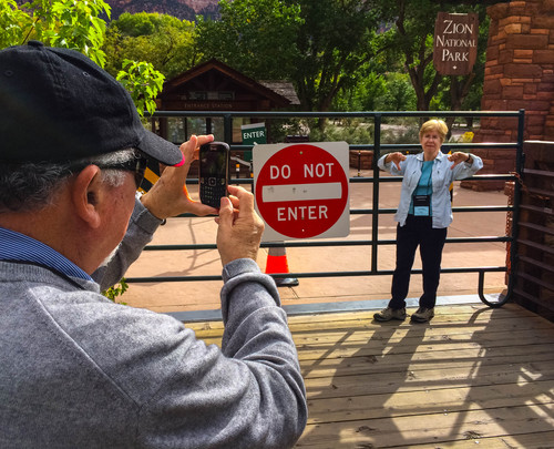 Trent Nelson  |  The Salt Lake Tribune
Donna Rice makes a thumbs down gesture for a photo taken by her husband Barry after they travelled from Chicago to Zion National Park only to find it closed due to the government shutdown, Wednesday, October 9, 2013.