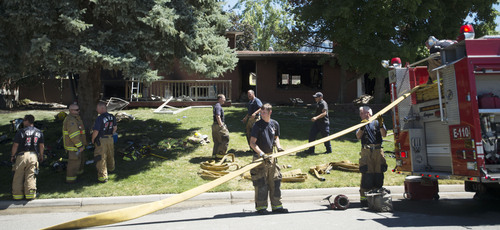 Steve Griffin  |  The Salt Lake Tribune


Unified Fire crews clean up after responding to a house fire near 7400 south 2200 east in Cottonwood Heights, Utah Tuesday, July 22, 2014.