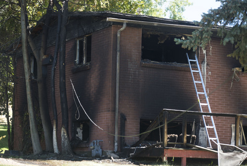Steve Griffin  |  The Salt Lake Tribune


Home near 7400 south 2200 east in Cottonwood Heights, Utah is gutted following a fire at the residence Tuesday, July 22, 2014.
