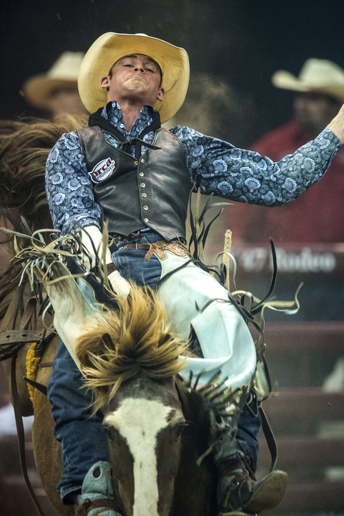 Chris Detrick  |  The Salt Lake Tribune
Kyle Brennecke, of Grain Valley, Mo., competes in bareback riding during the Days of '47 Rodeo at EnergySolutions Arena Tuesday July 22, 2014.
