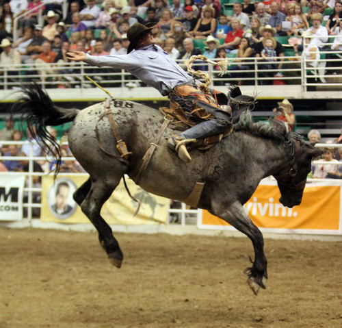 Rick Egan  | The Salt Lake Tribune 

Ad Bugenig, Ferndale, CA, competes in the Saddle Bronc Riding competition, in the Days of '47 Rodeo at EnergySolutions Arena, Wednesday, July 24, 2013.