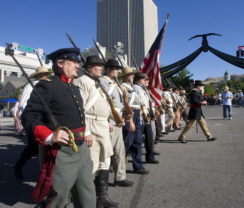 Al Hartmann  | The Salt Lake Tribune   
Members of the Utah Batallion of the Sons of the Utah Pioneers march at South Temple and State Streets to start the Days of '47 parade.