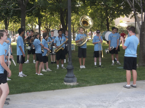 Sean P. Means  |  The Salt Lake Tribune
Members of the West Jordan High School Jaguar Bands warm up with Pharrell Williams' song "Happy" in front of Abravanel Hall, before the 2014 Days of '47 Parade in downtown Salt Lake City, Thursday, July 24, 2014.