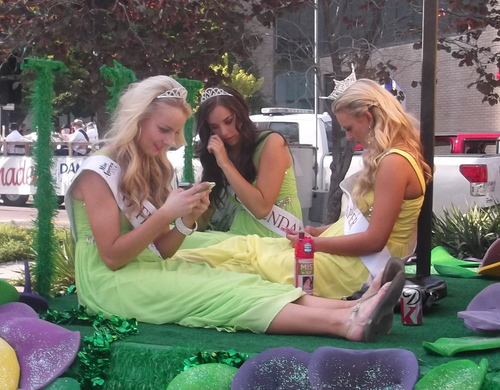 Sean P. Means  |  The Salt Lake Tribune
Miss Draper, Karli Bird (right), and her attendants, Brynn Garfield (left) and Lexi Smith, check their phones while waiting for their turn in the 2014 Days of '47 Parade in downtown Salt Lake City, on Thursday, July 24, 2014.