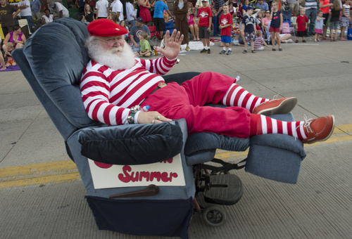 Rick Egan  |  The Salt Lake Tribune

Santa rides in his recliner, in the Handcart Days Parade in Bountiful, Wednesday, July 23, 2014
