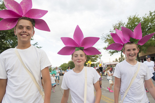 Rick Egan  |  The Salt Lake Tribune

Noah Russon, 13, Thomas Hills, 12, and Mitchell Anderson, 12, dress as flowers, in the Handcart Days Parade in Bountiful, Wednesday, July 23, 2014
