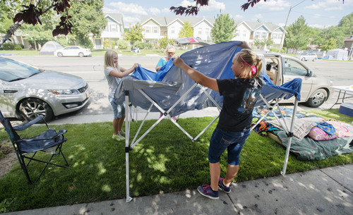 Steve Griffin  |  The Salt Lake Tribune


Sharon Worsencroft, center gets help from her daughter, Jennie, right,  and granddaughter Bailey as they begin setting up camp along the Days of 47 Parade route in  Salt Lake City, Utah Wednesday, July 23, 2014.