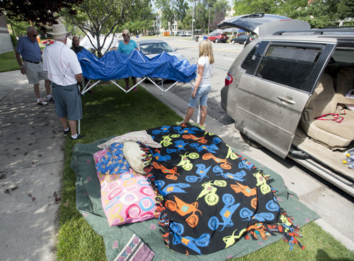 Steve Griffin  |  The Salt Lake Tribune


Dick Wood and Scott Bringhurst, left, team up with Sharon Worsencroft, center, her daughter, Jennie, and granddaughter Bailey as they set up a sun shades along the Days of 47 Parade route in  Salt Lake City, Utah Wednesday, July 23, 2014.