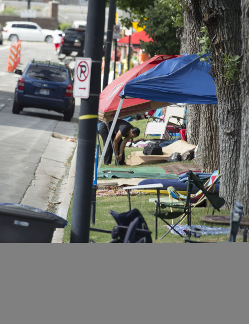 Steve Griffin  |  The Salt Lake Tribune


People begin setting up camp along the Days of 47 Parade route in  Salt Lake City, Utah Wednesday, July 23, 2014.