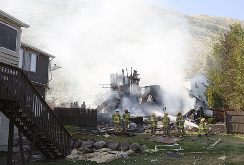 Al Hartmann  |  The Salt Lake Tribune 
Unified Fire and emergency personnel respond to an explosion and fire at 15091 South Junction Circle in Draper Friday July 25.