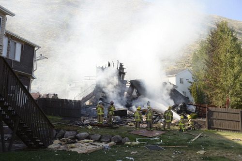 Al Hartmann  |  The Salt Lake Tribune 
Unified Fire and emergency personnel respond to an explosion and fire at 15091 South Junction Circle in Draper Friday July 25.