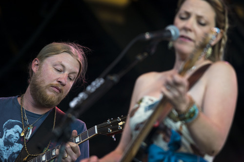 Steve Griffin  |  The Salt Lake Tribune


Husband-and-wife Derek Trucks and Susan Tedeschi jam together during the Tedeschi Trucks Band show at the Red Butte Garden Concert Series in Salt Lake City, Utah Tuesday, July 22, 2014. The band is an 11-member collective that thrills audiences worldwide with its transcendent live performances and award-winning albums. The band was formed in 2010 Tedeschi and Trucks.