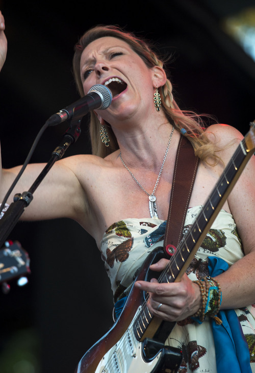 Steve Griffin  |  The Salt Lake Tribune


Susan Tedeschi sings during the Tedeschi Trucks Band show at the Red Butte Garden Concert Series in Salt Lake City, Utah Tuesday, July 22, 2014. The band is an 11-member collective that thrills audiences worldwide with its transcendent live performances and award-winning albums. The band was formed in 2010 husband-and-wife Susan Tedeschi and Derek Trucks.