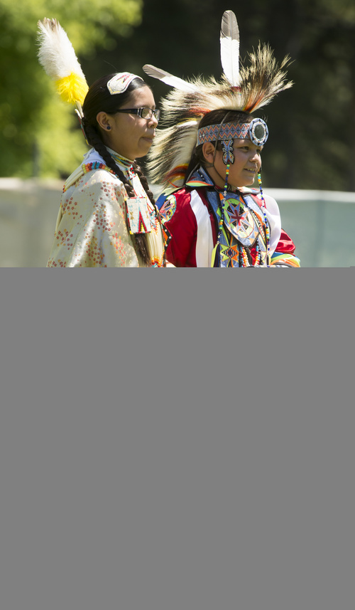 Rick Egan  |  The Salt Lake Tribune

Tianna Redhouse, and Diondre Begay, dance at the Native American Pow Wow, at Liberty Park, Thursday, July 24, 2014