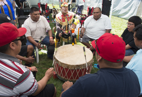 Rick Egan  |  The Salt Lake Tribune

The Eagle Creek Singers, sing and beat the drum for the dancers at the Native American Pow Wow, at Liberty Park, Thursday, July 24, 2014