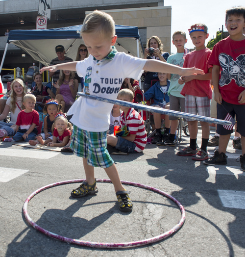 Rick Egan  |  The Salt Lake Tribune

Korver Moline, 4, Syracuse, shoes his hula- hooping talents, during the Days of 47 Pioneer Parade, in Salt Lake CIty, Thursday, July 24, 2014