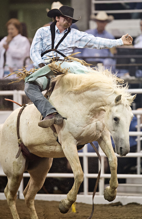 Lennie Mahler  |  The Salt Lake Tribune
McKay Mann scores a 72 in the bareback bronc riding event of the Days of '47 Rodeo at EnergySolutions Arena, Friday, July 25, 2014.