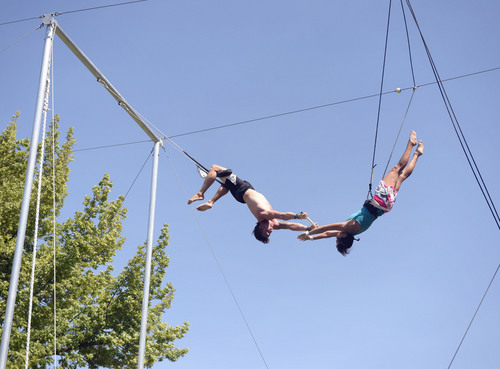 Al Hartmann  |  The Salt Lake Tribune 
Utah Flying Trapeze is open at the the south side of Pioneer Park Wednesday July 23.  A trapeze set complete with safety harnesses, nets and instruction will be offered to the public throughout weekdays by the Utah Flying Trapeze group.