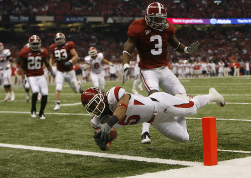 Chris Detrick | The Salt Lake Tribune

Utah wide receiver Brent Casteel (5) dives into the endzone past Alabama cornerback Kareem Jackson (3) to score the first touchdown of the game as the Utes face Alabama in the 75th Anniversary Sugar Bowl in New Orleans, Louisiana, Friday, January 2, 2008.