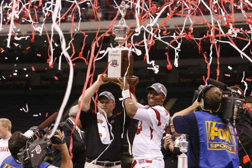 Scott Sommerdorf  |  The Salt Lake Tribune
Utah head coach Kyle Whittingham  and Utah quarterback Brian Johnson (3) hold their trophy aloft after the Utes defeated Alabama in the 75th annual Sugar Bowl in New Orleans, Friday, January 2, 2009.
