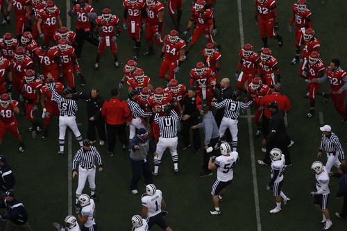 Officials break up a scuffle between Utah and BYU football players before their game Saturday at Rice-Eccles Stadium.
Chris Detrick/The Salt Lake Tribune/November 22, 2008