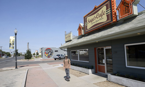 Al Hartmann  |  The Salt Lake Tribune 
Skateboarder goes past Sage Restaurant at 234 West 900 South, the "NInth Central" neighborhood.    The 900 South corridor from 900 East to 900 West is the subject of a recent report.  City Hall wants to take a closer look at reinvigorating the route as a commercial and cultural line between the east side the west side.