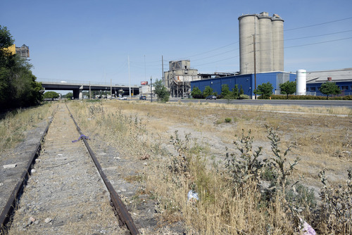 Al Hartmann  |  The Salt Lake Tribune 
Abandoned railroad tracks and weeds lie on the southside of 900 West at about 500 West, the "Granary District."  The 900 South corridor from 900 East to 900 West is the subject of a recent report.  City Hall wants to take a closer look at reinvigorating the route as a commercial and cultural line between the east side the west side.