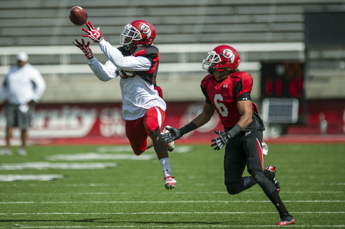 Chris Detrick  |  The Salt Lake Tribune
Utah Utes defensive back Eric Rowe (18) breaks up a pass intended for Utah Utes wide receiver Dres Anderson (6) during a scrimmage at Rice-Eccles Stadium DOW} April 12, 2014.