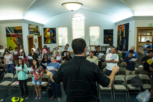 Chris Detrick  |  The Salt Lake Tribune
Artistic director Dr. Brady Allred conducts members of the Salt Lake Choral Artists, community singers and guests from the Philippines during a choir camp practice Friday July 11, 2014.