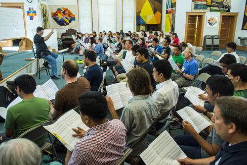 Chris Detrick  |  The Salt Lake Tribune
Artistic director Dr. Brady Allred conducts members of the Salt Lake Choral Artists, community singers and guests from the Philippines during a choir camp practice Friday July 11, 2014.