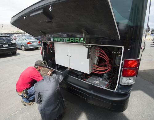 Steve Griffin  |  The Salt Lake Tribune


UTA officials get a closer look at the high voltage system of a Proterra battery electric 40-foot bus at UTA offices in Salt Lake City, Utah Monday, July 28, 2014. UTA is considering buying some of the $825,000 busses.
