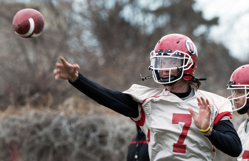 Steve Griffin  |  The Salt Lake Tribune

University of Utah quarterback Travis Wilson runs plays during spring practice on the University of Utah campus in Salt Lake City, Utah Tuesday, March 18, 2014.
