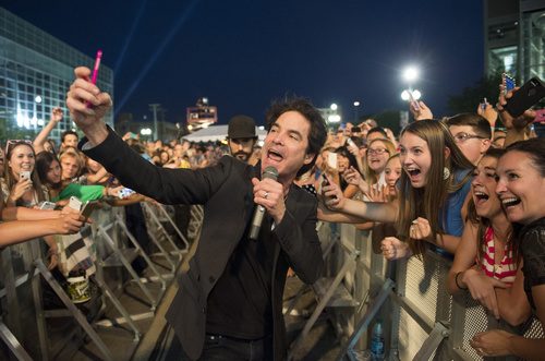 Rick Egan  |  The Salt Lake Tribune
Train lead singer, Pat Monahan, takes a selfie with fans during their free concert outside EnergySolutions Arena on Saturday.