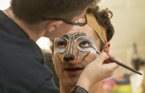 Rick Egan  |  The Salt Lake Tribune

Assistant Wig Master, Lauren Cecil, applies make up to Peter Saide, for his role as The Wolf, in the Utah Shakespeare Festival's "Into The Woods"  Saturday, July 5, 2014