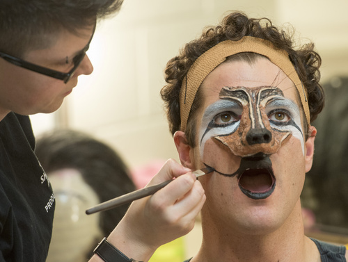 Rick Egan  |  The Salt Lake Tribune

Lauren Cecil, Assistant Wigmaster, applies make up to Peter Saide, for his role as The Wolf, in the Utah Shakespeare Festival's "Into The Woods"  Saturday, July 5, 2014