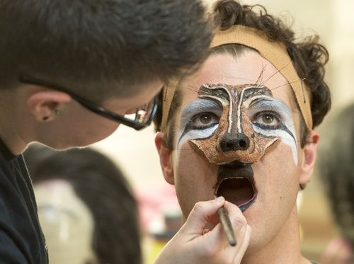 Rick Egan  |  The Salt Lake Tribune

Assistant Wig Master, Lauren Cecil, applies make up to Peter Saide, for his role as The Wolf, in the Utah Shakespeare Festival's "Into The Woods"  Saturday, July 5, 2014