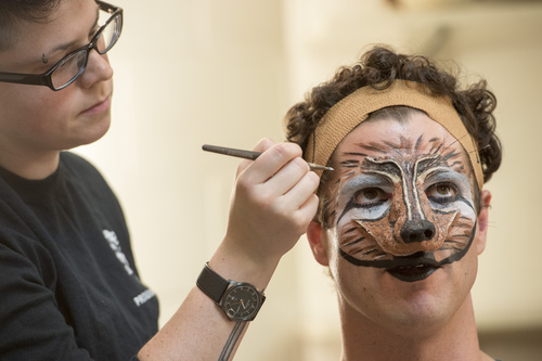 Rick Egan  |  The Salt Lake Tribune

Lauren Cecil, Assistant Wigmaster, applies make up to Peter Saide, for his role as The Wolf, in the Utah Shakespeare Festival's "Into The Woods"  Saturday, July 5, 2014