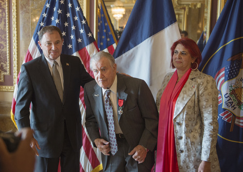 Steve Griffin  |  The Salt Lake Tribune


Marie-Helene Glon, Honorary Consul of the Republic of France in Utah, right, and Gov. Gary Herbert stand with World War II veteran Dean C. Larson after he was awarded with the French Legion of Honor in the Gold Room at the Utah Capitol Thursday, July 31, 2014. He was given the honor by the French government for the merit and bravery he exhibited while fighting on French territory during World War II.