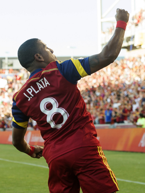 Real Salt Lake forward Jou Plata (8) celebrates his first half goal, in MLS action against the New York Red Bulls at Rio Tinto Stadium, in Salt Lake City, Wednesday, July 30, 2014.  (AP Photo/The Salt Lake Tribune, Rick Egan)  DESERET NEWS OUT; LOCAL TELEVISION OUT; MAGS OUT