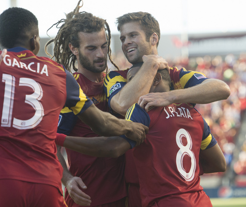 Rick Egan  |  The Salt Lake Tribune

Real Salt Lake forward Jou Plata (8) is swarmed by team mates, Real Salt Lake midfielder Kyle Beckerman (5) and Real Salt Lake defender Chris Wingert (17) and Real Salt Lake forward Olmes Garcia (13) as they celebrate Plata's first period goal, in MLS action at Rio Tinto Stadium, Wednesday, July 30, 2014