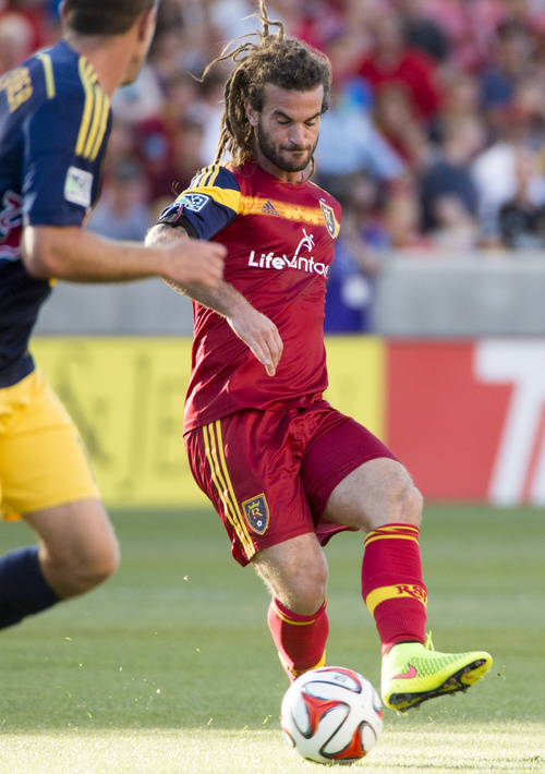 Real Salt Lake midfielder Kyle Beckerman, right, controls the ball, in MLS action against the New York Red Bulls at Rio Tinto Stadium, in Salt Lake City, Wednesday, July 30, 2014.  (AP Photo/The Salt Lake Tribune, Rick Egan)  DESERET NEWS OUT; LOCAL TELEVISION OUT; MAGS OUT