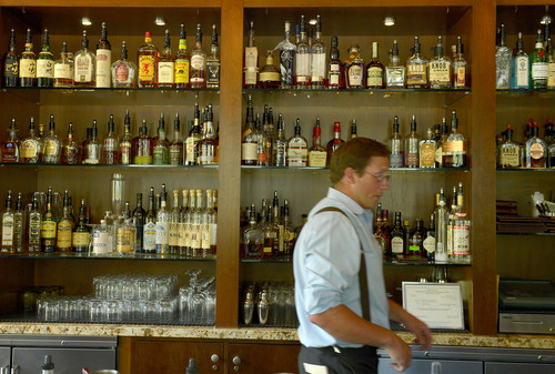 Leah Hogsten  |  The Salt Lake Tribune
Burgers & Bourbon bartender Mark Nesmith has a well-stocked bar of bourbon to work with.  Burgers & Bourbon, a restaurant inside the Montage Deer Valley that specializes in hamburgers and bourbon, July 25, 2014.
