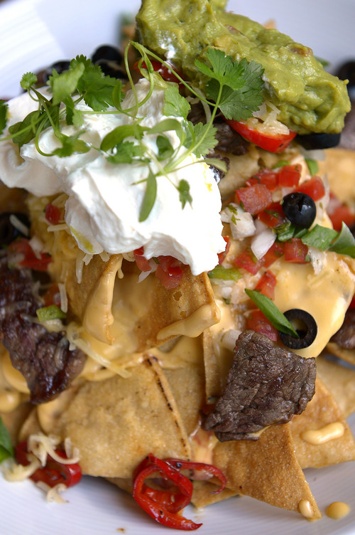 Leah Hogsten  |  The Salt Lake Tribune
Wagyu Nachos with steak, pico, guacamole, olives, peppers and scallions, $23. Burgers & Bourbon, a restaurant inside the Montage Deer Valley that specializes in hamburgers and bourbon, July 25, 2014.