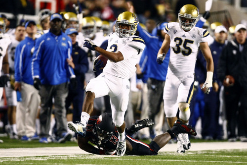 Chris Detrick  |  The Salt Lake Tribune
UCLA Bruins safety Randall Goforth (3) runs past Utah Utes running back Kelvin York (13) after intercepting the ball during the first half of the game at Rice-Eccles Stadium Thursday October 3, 2013. UCLA is winning the game 21-17.