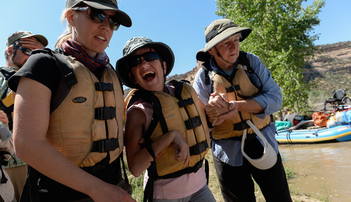 Francisco Kjolseth  |  The Salt Lake Tribune
Carol Robertson expresses her enthusiasm for another day on the river as SPLORE director Janine Donald, left, and volunteer Pat Burg lend a hand getting her onboard.